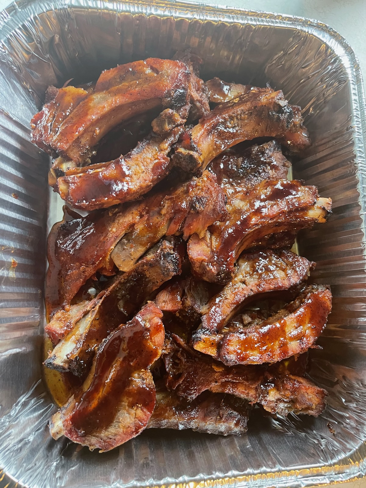 Pan of glazed BBQ ribs